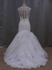 Elegant Trumpet/Mermaid Sweetheart Tulle Wedding Dress with Cascading Ruffles and Sweep Train